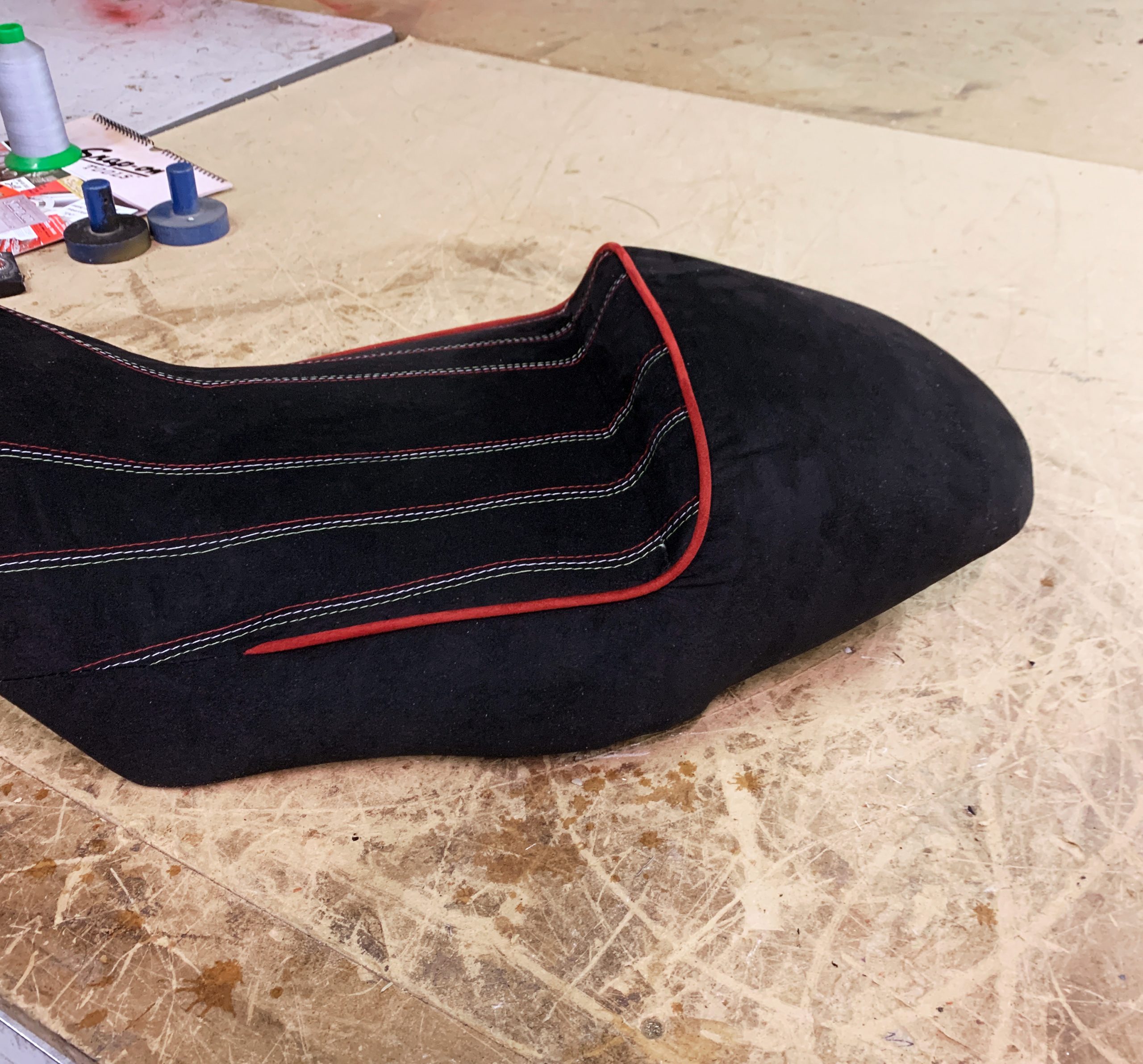 Black+fabric+motorcycle+seat+with+red+and+white+stitching+and+red+piping